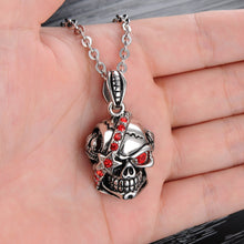 Load image into Gallery viewer, Bloody Stainless Steel and Cubic Zirconia Skull Pendant